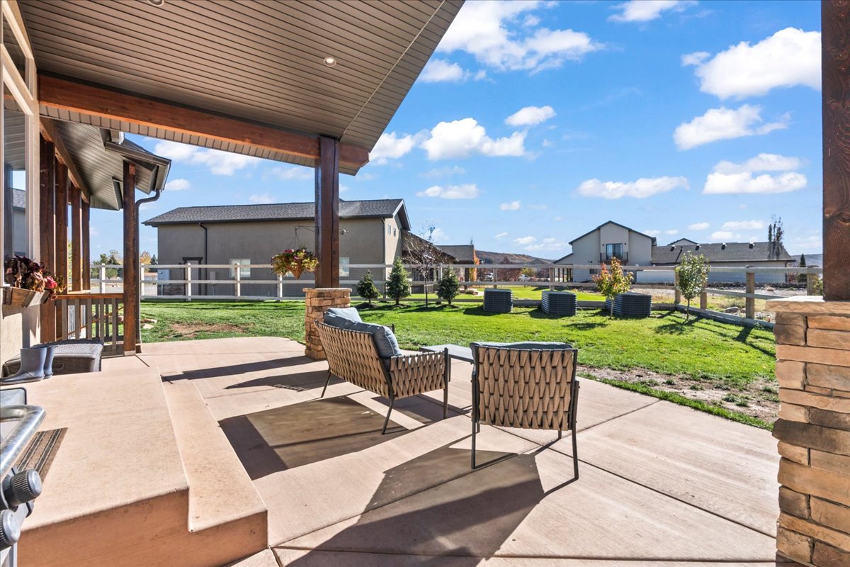 View of  back covered patio- accessible from Primary bedroom and Great room.