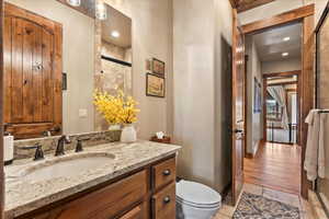 Bathroom featuring vanity and a shower with shower door