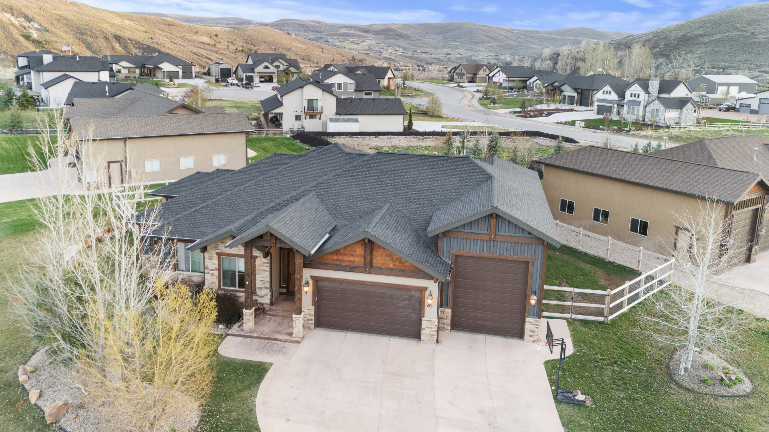Aerial perspective of suburban area featuring a mountainous background