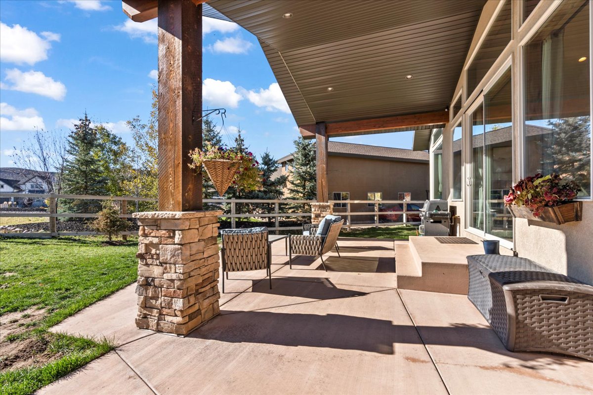 View of  back covered patio- accessible from Primary bedroom and Great room.