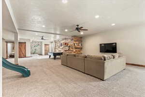Living area featuring light carpet, pool table, recessed lighting, and ceiling fan