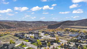 Aerial perspective of suburban area with a mountainous background