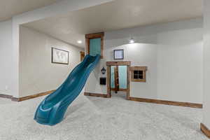 Built-in Playhouse featuring Slide, mailbox and window