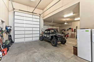 Garage with freestanding refrigerator