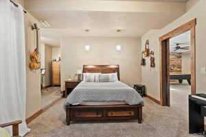 Bedroom with light carpet and baseboards