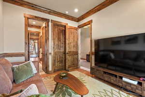 Living room featuring wood finished floors and recessed lighting