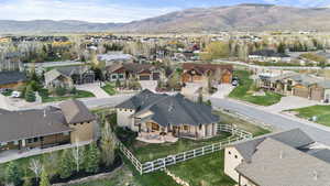 Aerial perspective of suburban area with a mountainous background