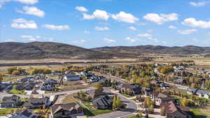 Aerial perspective of suburban area with a mountainous background