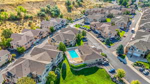Aerial view of residential area featuring a pool