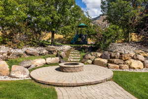 View of patio / terrace with an outdoor fire pit