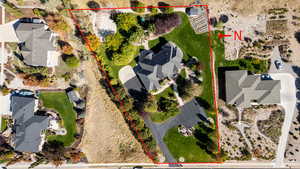 Aerial perspective of suburban area with property parcel outlined