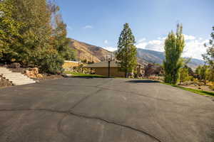 View of guest parking with a mountain view