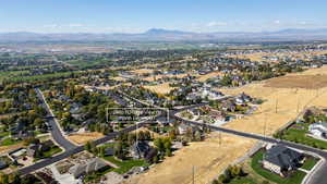 View of property location featuring nearby suburban area, a mountainous background, and property boundaries highlighted