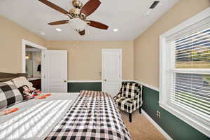 Carpeted bedroom with recessed lighting and a ceiling fan