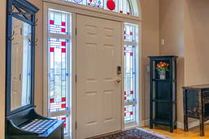 Entryway featuring wood finished floors and baseboards