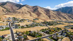 View of mountain background featuring nearby suburban area