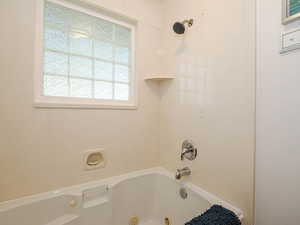 Full bathroom featuring a combined bath / shower with jetted tub