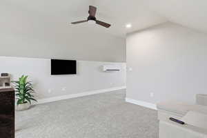 ABOVE GARAGE: Living room with lofted ceiling, light carpet, a ceiling fan, and recessed lighting