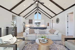 WOOD BEAMS & Living room featuring high vaulted ceiling, ceiling fan, light wood-style flooring, beam ceiling, and recessed lighting