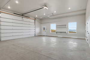 Garage featuring recessed lighting and a garage door opener