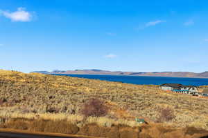 View of mountain background with a nearby body of water