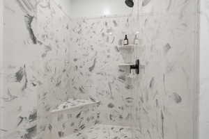 MASTER: Bathroom with a marble finish shower