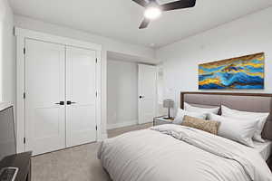 Virtual Staged: Bedroom featuring light carpet, a closet, and ceiling fan