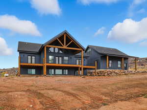 South West View of Home and Garage with deck and patio