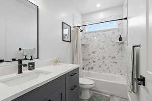 Bathroom with shower / bath combination with curtain, vanity, and light wood finished floors