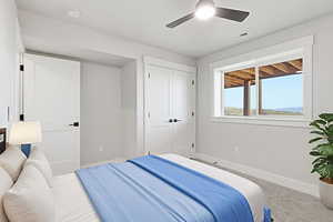 Virtual Staged: Carpeted bedroom featuring a ceiling fan and a closet