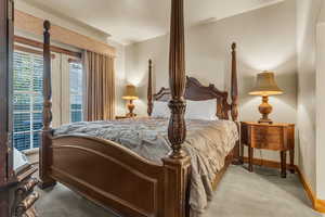 Bedroom with carpet flooring and access to outside