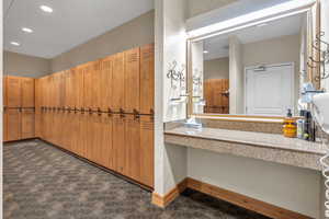 Spacious closet featuring dark carpet