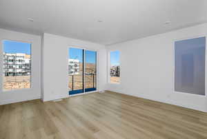 Empty room featuring light wood-style flooring and baseboards