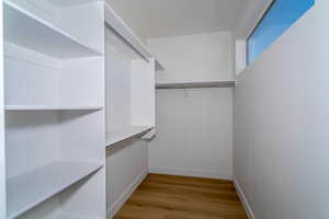 Spacious closet with light wood-style floors
