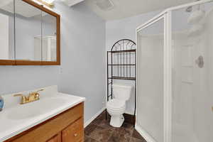 Bath featuring vanity and a shower