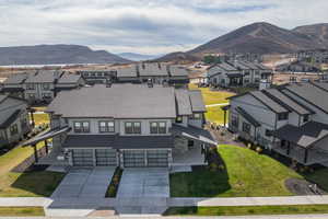 Aerial view of residential area featuring a mountain backdrop