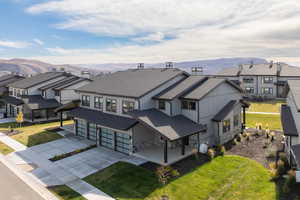 Aerial perspective of suburban area featuring a mountain backdrop