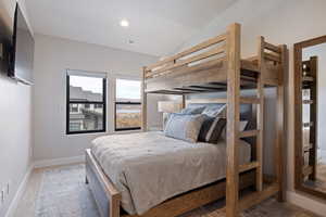 Bedroom featuring recessed lighting and vaulted ceiling