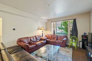Living area with carpet floors and baseboards