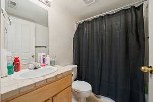 Full bathroom with vanity and light tile patterned flooring