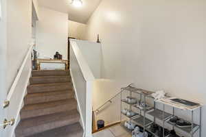 Stairway featuring tile patterned flooring