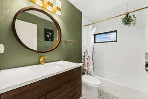 Bathroom with vanity and shower / bath combo