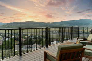 Balcony at dusk with a mountain view