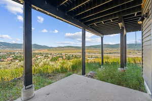 View of patio / terrace with a mountain view