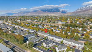 Aerial view of property's location with mountains and nearby suburban area