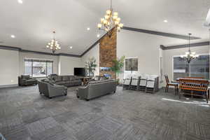 Community lobby featuring high vaulted ceiling, recessed lighting, and ornamental molding