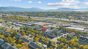 Aerial overview of property's location featuring a mountain backdrop and a major roadway