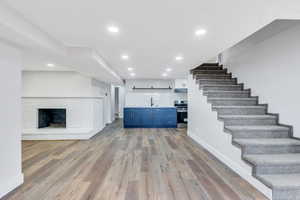 Lower level has family room, kitchen, bathroom, laundry, and 4 bedrooms!