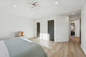 Bedroom featuring light wood-type flooring and recessed lighting