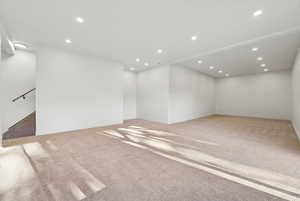 Spare room with recessed lighting and light colored carpet